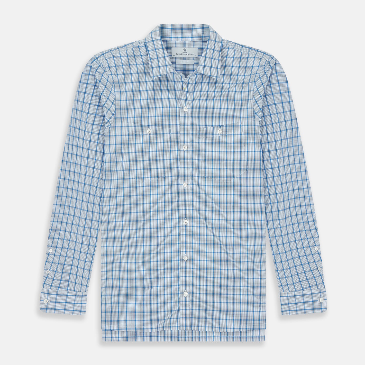 View 1 of product The Turnbull & Asser Blue Graph Overlay Check Piccadilly Shirt is a breathable cotton button-up featuring a collar, two chest pockets, white buttons, and an elegant blue graph check—perfect for the holidays.