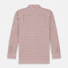 View 6 of product The Turnbull & Asser Red Graph Overlay Check Piccadilly Shirt is a cotton, long-sleeve button-up with a white base, red graph check pattern, collar, two chest flap pockets, and white buttons on the front and cuffs.