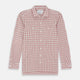 The Turnbull & Asser Red Graph Overlay Check Piccadilly Shirt is a cotton, long-sleeve button-up with a white base, red graph check pattern, collar, two chest flap pockets, and white buttons on the front and cuffs.