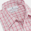 View 2 of product The Pink Graph Overlay Check Piccadilly Shirt by Turnbull & Asser features long sleeves, a button-up front, collar, and chest pockets—a stylish cotton option in a red and white check pattern for the holidays.