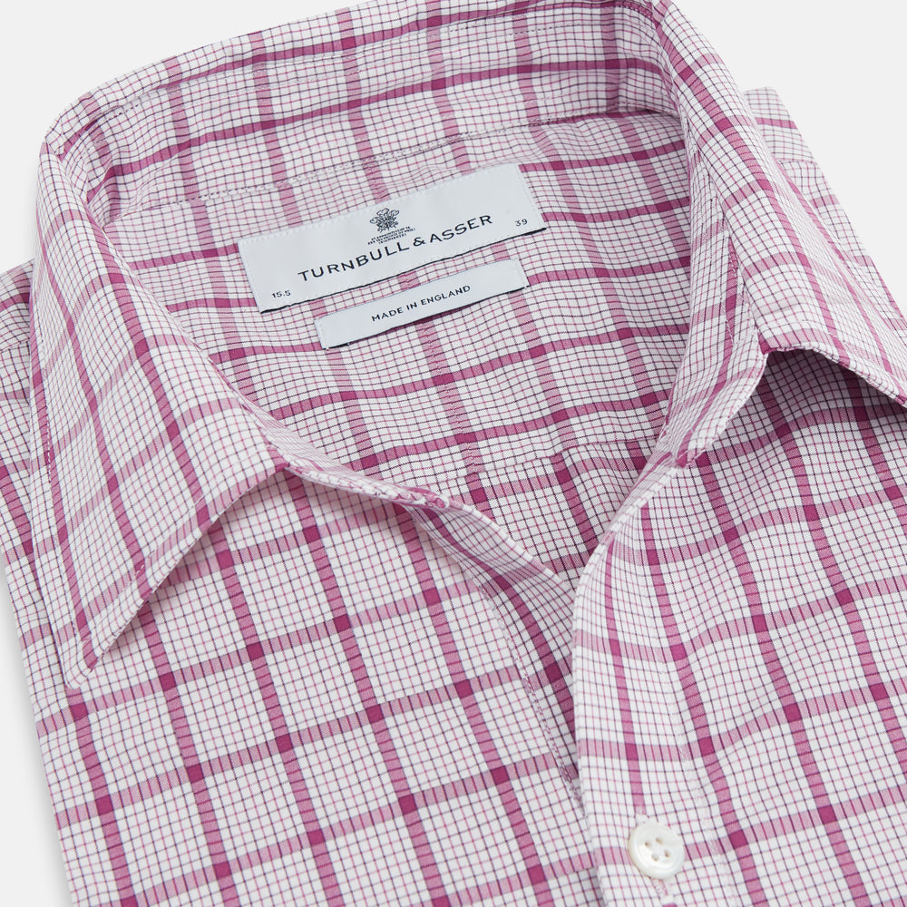 The Turnbull & Asser Purple Graph Overlay Check Piccadilly Shirt, a long-sleeve cotton button-up with two buttoned chest pockets, is neatly laid flat on a plain white background.
