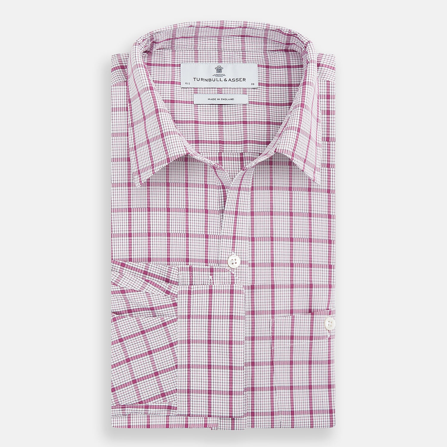 View 5 of product The Turnbull & Asser Purple Graph Overlay Check Piccadilly Shirt, a long-sleeve cotton button-up with two buttoned chest pockets, is neatly laid flat on a plain white background.