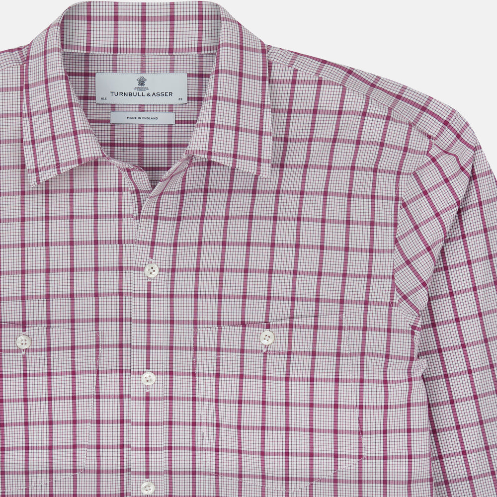 The Turnbull & Asser Purple Graph Overlay Check Piccadilly Shirt, a long-sleeve cotton button-up with two buttoned chest pockets, is neatly laid flat on a plain white background.