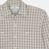 View 4 of product The Turnbull & Asser Brown Graph Overlay Check Piccadilly Shirt is a breathable cotton long-sleeve button-up with two chest pockets, in a beige and brown check pattern—ideal as your holiday fit shirt.