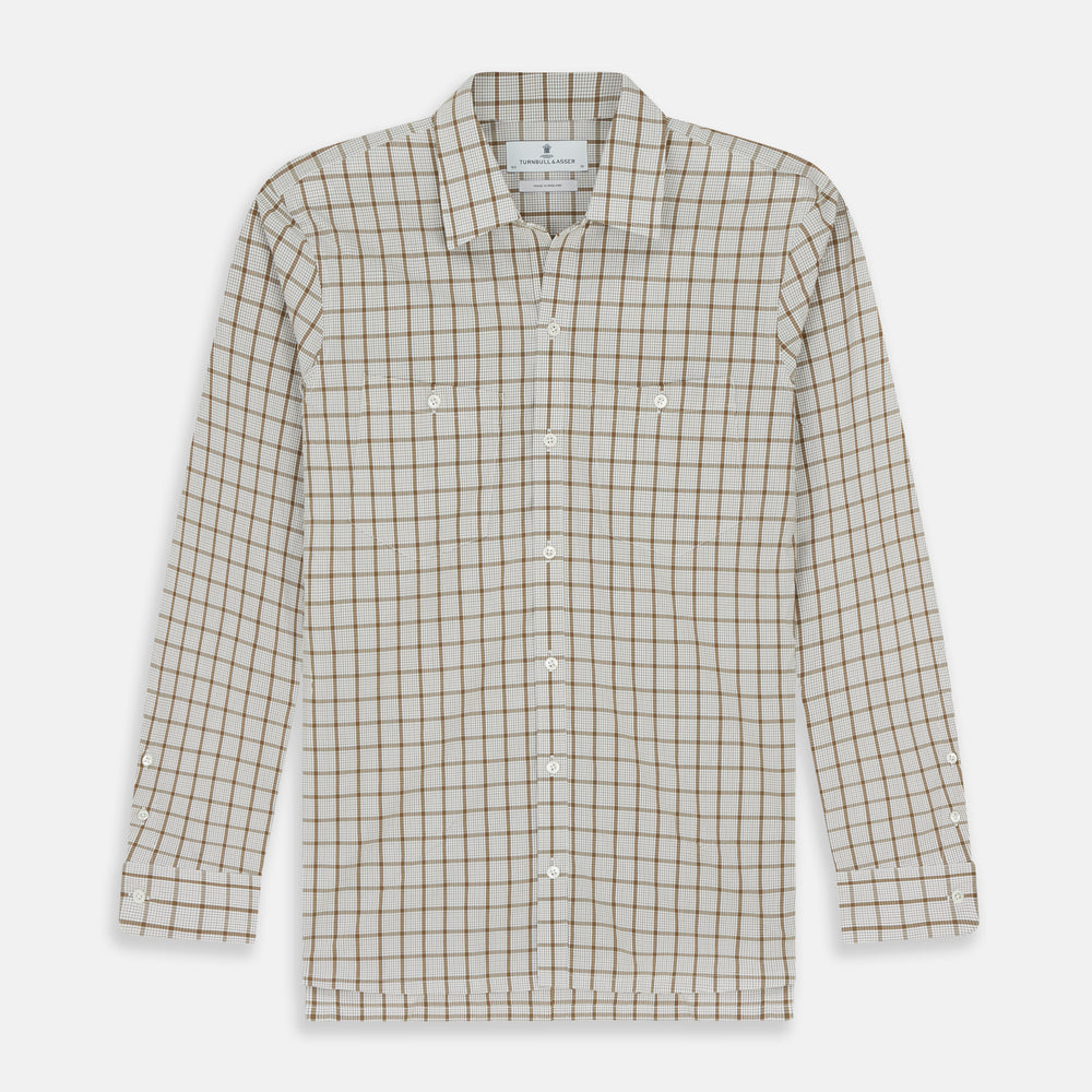The Turnbull & Asser Brown Graph Overlay Check Piccadilly Shirt is a breathable cotton long-sleeve button-up with two chest pockets, in a beige and brown check pattern—ideal as your holiday fit shirt.