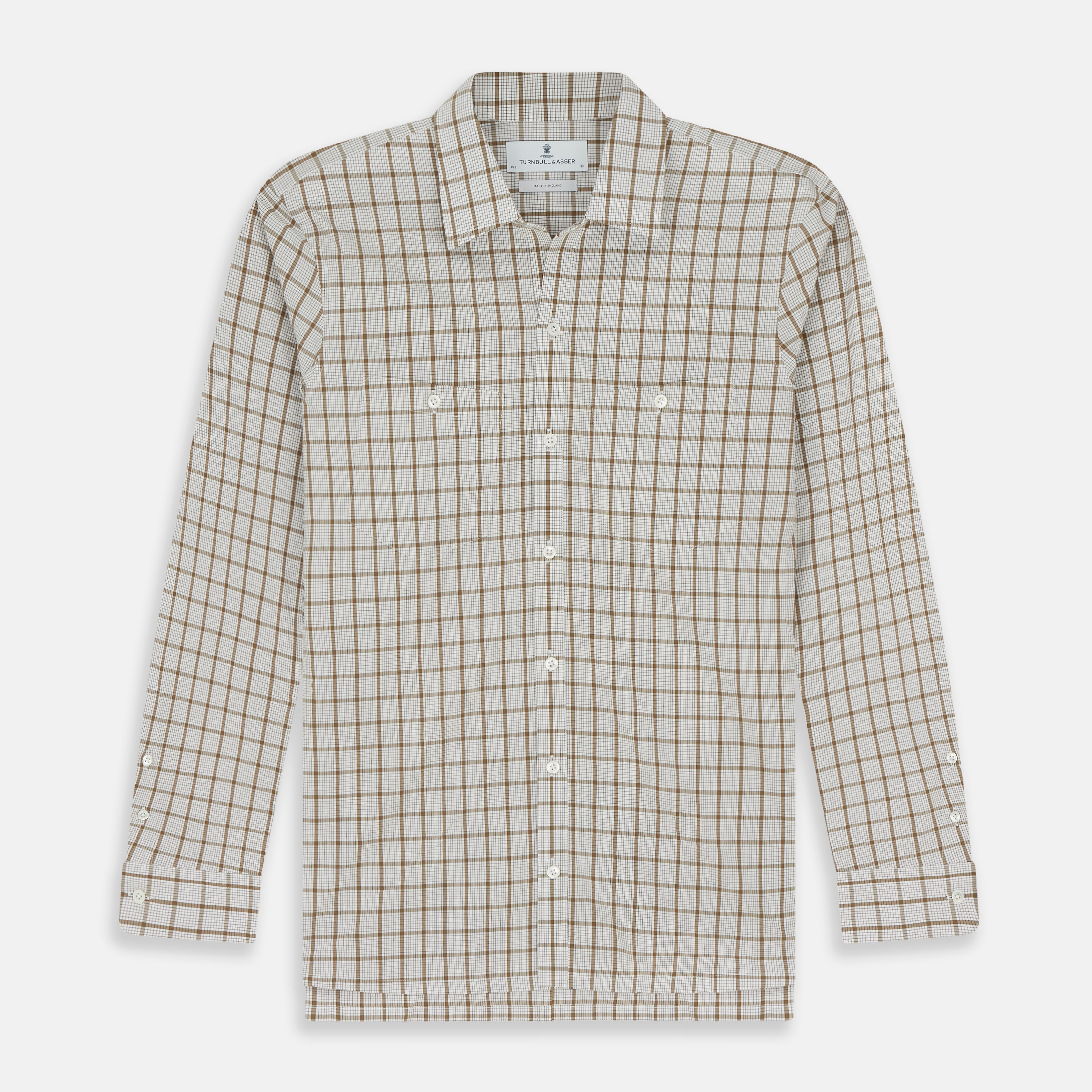 View 1 of product The Turnbull & Asser Brown Graph Overlay Check Piccadilly Shirt is a breathable cotton long-sleeve button-up with two chest pockets, in a beige and brown check pattern—ideal as your holiday fit shirt.