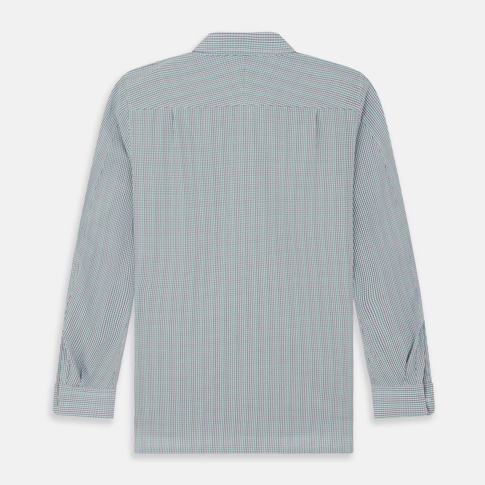 The Turnbull & Asser Green Graph Overlay Micro Check Piccadilly Shirt is a breathable cotton, long-sleeve button-up featuring a green micro check in light blue and white, two chest pockets with buttoned flaps, and white buttons.