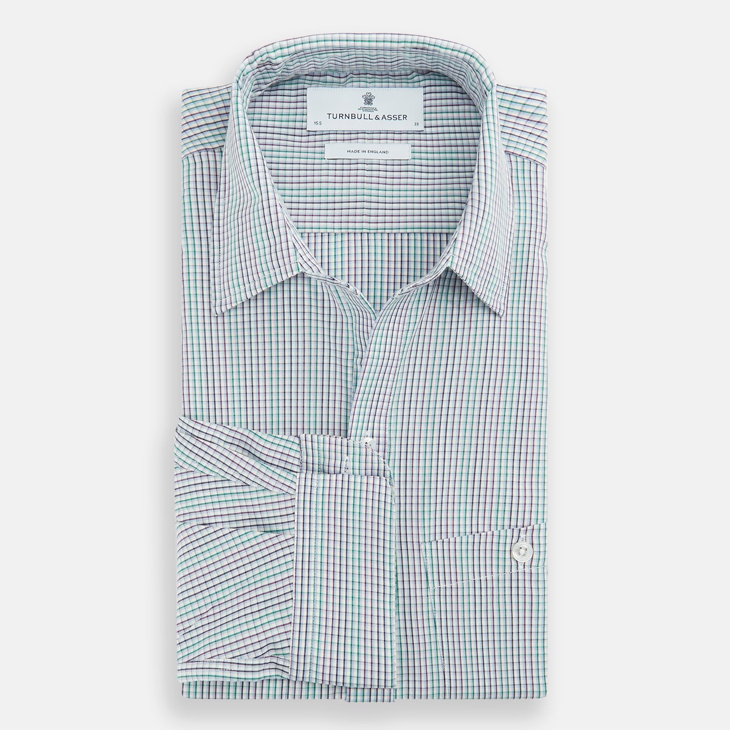 View 5 of product The Turnbull & Asser Green Graph Overlay Micro Check Piccadilly Shirt is a breathable cotton, long-sleeve button-up featuring a green micro check in light blue and white, two chest pockets with buttoned flaps, and white buttons.