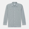 View 1 of product The Turnbull & Asser Green Graph Overlay Micro Check Piccadilly Shirt is a breathable cotton, long-sleeve button-up featuring a green micro check in light blue and white, two chest pockets with buttoned flaps, and white buttons.