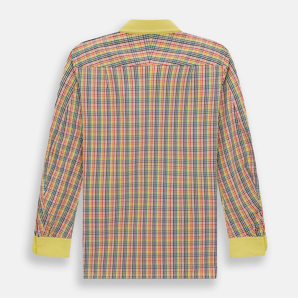The Portobello Shirt by Turnbull & Asser is a long-sleeve, button-up with a vibrant red, blue, yellow, and green check pattern and a solid yellow collar—ideal for a market-inspired holiday look.