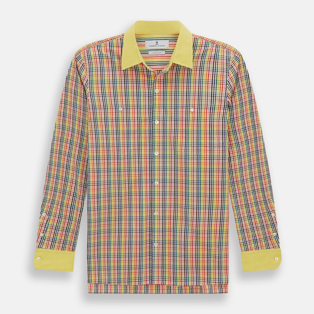 The Portobello Shirt by Turnbull & Asser is a long-sleeve, button-up with a vibrant red, blue, yellow, and green check pattern and a solid yellow collar—ideal for a market-inspired holiday look.
