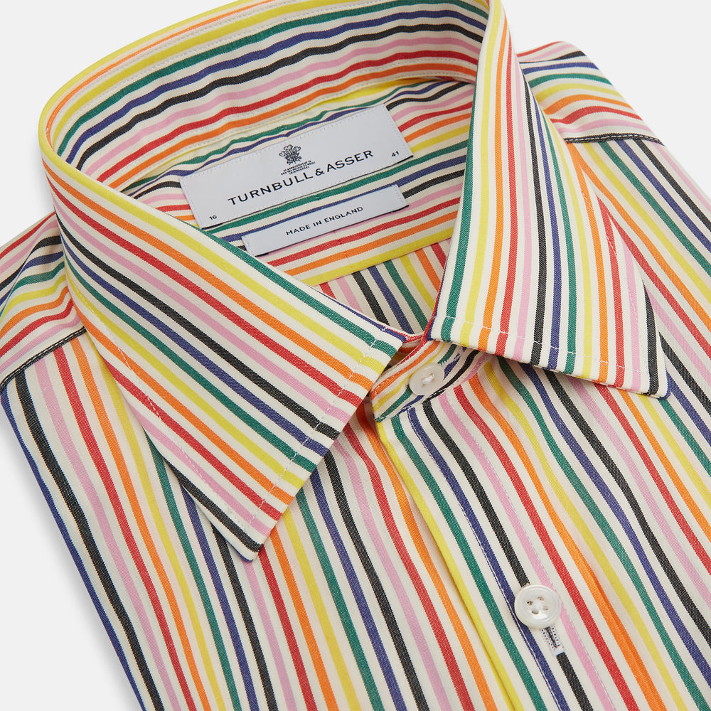 The MULTICOLOURED FELICIANO MAYFAIR SHIRT by Turnbull & Asser features vertical red, yellow, green, and blue stripes on white, a classic T&A collar, buttoned cuffs, and a rounded hem for timeless British style.