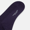 View 3 of product A single Dark Purple Mid-Length Merino Sock from Turnbull & Asser is shown upright on a plain white background, highlighting its ribbed texture.