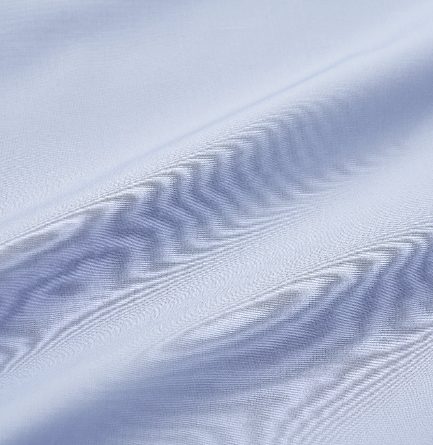 View 3 of product The Turnbull & Asser Blue Piped Sea Island Quality Cotton Nightshirt features light blue sea island cotton, a collared neckline with white piping, a front pocket, partial button placket, and a curved high-low hem for classic nightshirt style.