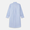 View 5 of product The Turnbull & Asser Blue Piped Sea Island Quality Cotton Nightshirt features light blue sea island cotton, a collared neckline with white piping, a front pocket, partial button placket, and a curved high-low hem for classic nightshirt style.