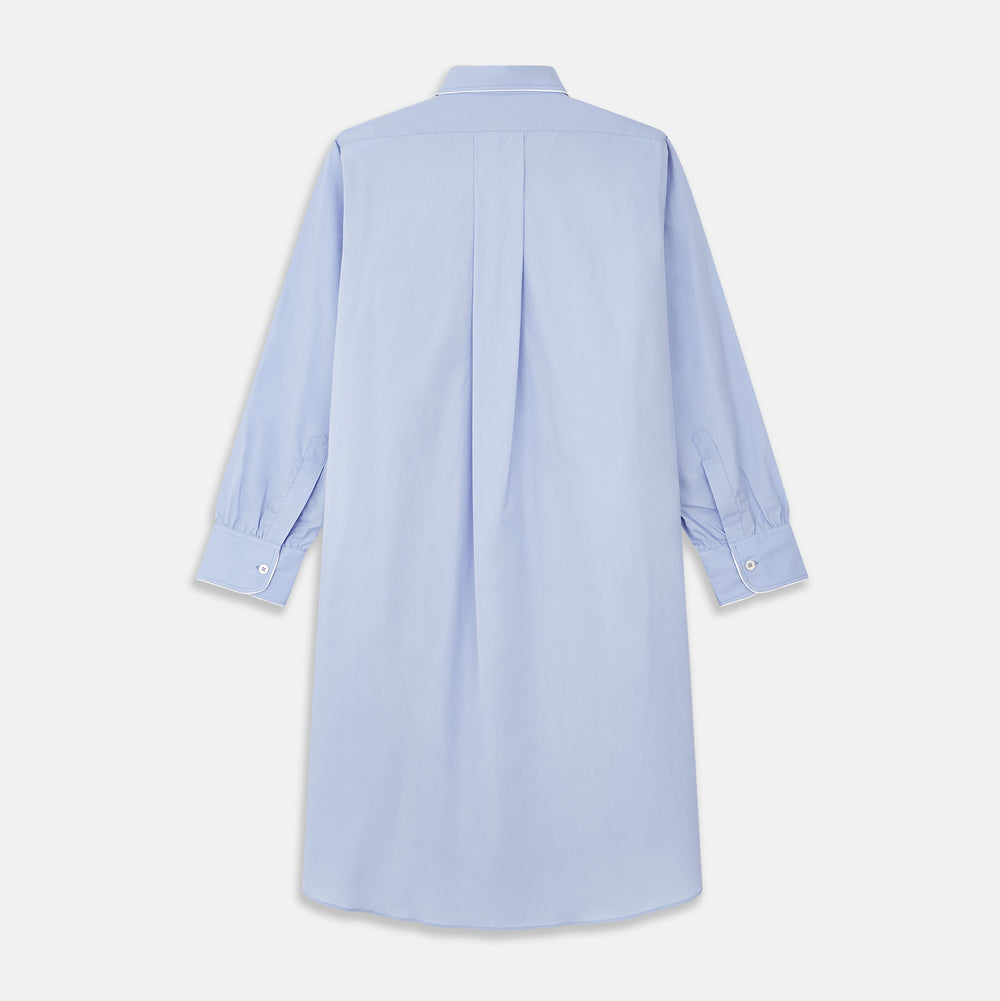 The Turnbull & Asser Blue Piped Sea Island Quality Cotton Nightshirt features light blue sea island cotton, a collared neckline with white piping, a front pocket, partial button placket, and a curved high-low hem for classic nightshirt style.