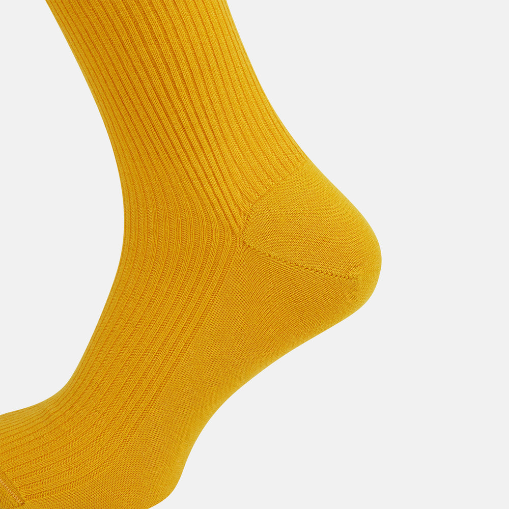 A single Yellow Mid-Length Merino Sock from Turnbull & Asser stands upright against a plain white background.