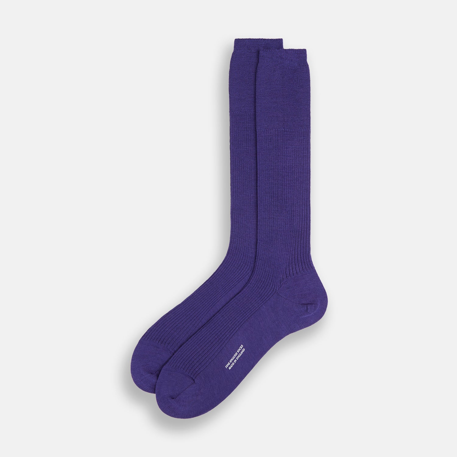 View 2 of product The Turnbull & Asser Violet Mid-Length Merino Socks, crafted from luxurious merino wool, feature a knee-high ribbed design and are shown upright against a plain white background.