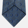 View 5 of product The Turnbull & Asser Die Another Day Circle Silk Tie, as seen on James Bond, features large dark blue ovals on a lighter blue background.
