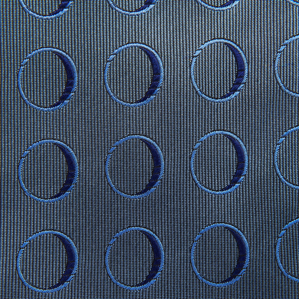 The Turnbull & Asser Die Another Day Circle Silk Tie, as seen on James Bond, features large dark blue ovals on a lighter blue background.