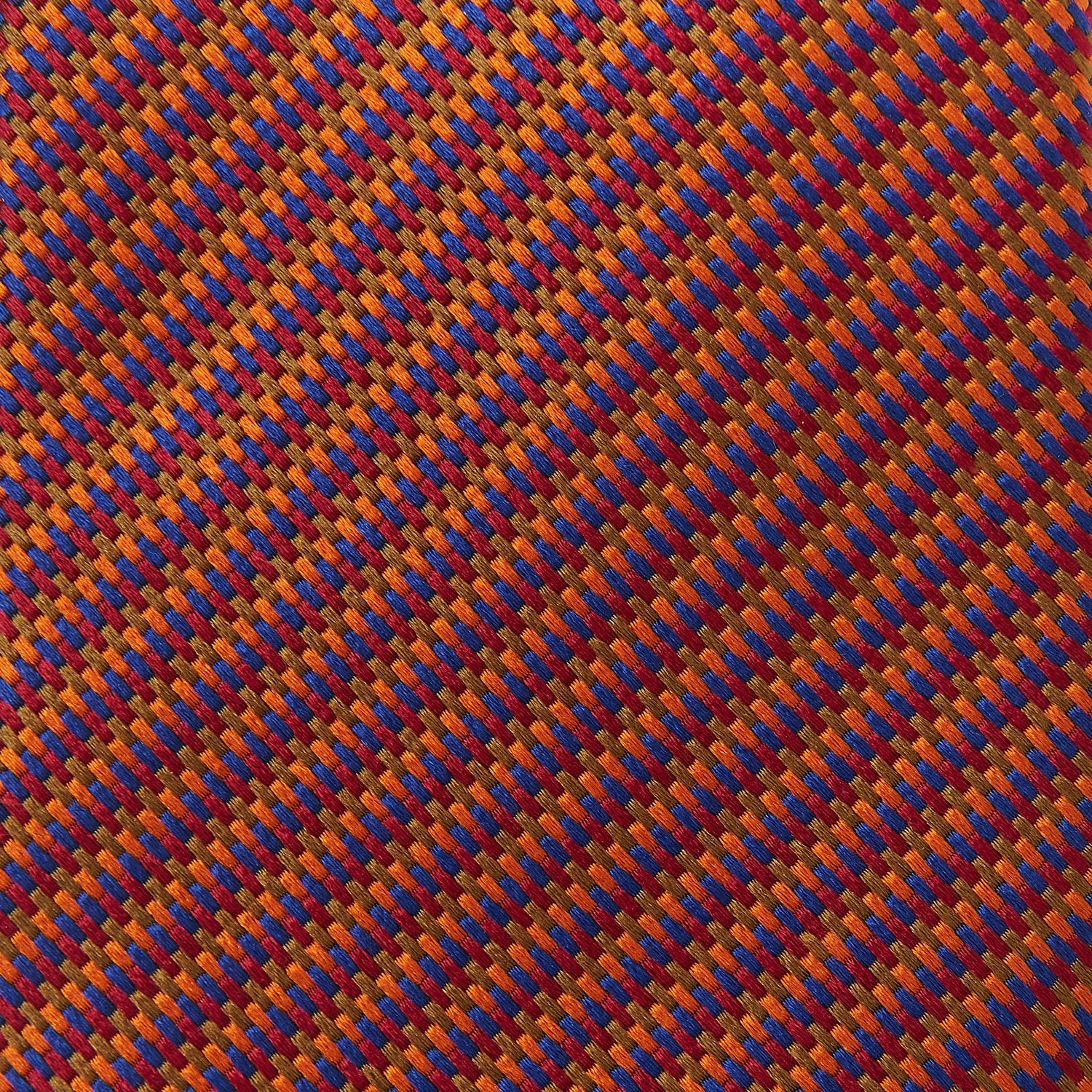 View 4 of product The Turnbull & Asser Die Another Day Stripe Silk Tie, as seen on James Bond, showcases a vibrant orange, red, and purple woven pattern, elegantly rolled and displayed against a white background.