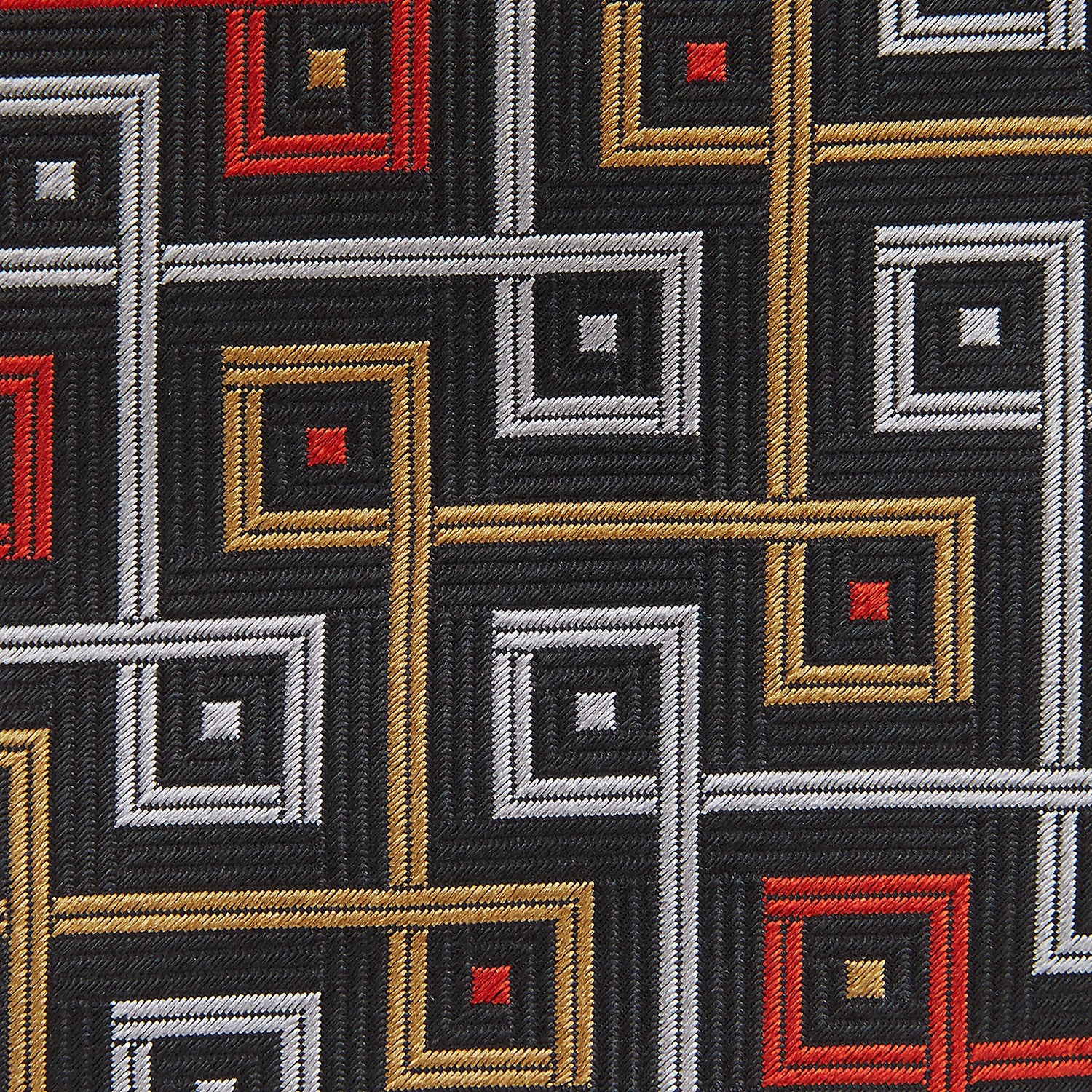 View 4 of product The Turnbull & Asser "The World Is Not Enough" Square Silk Tie, as seen on James Bond, features a geometric diamond pattern in black, red, yellow, and white on gray—an ideal stylish gift for any Bond fan.