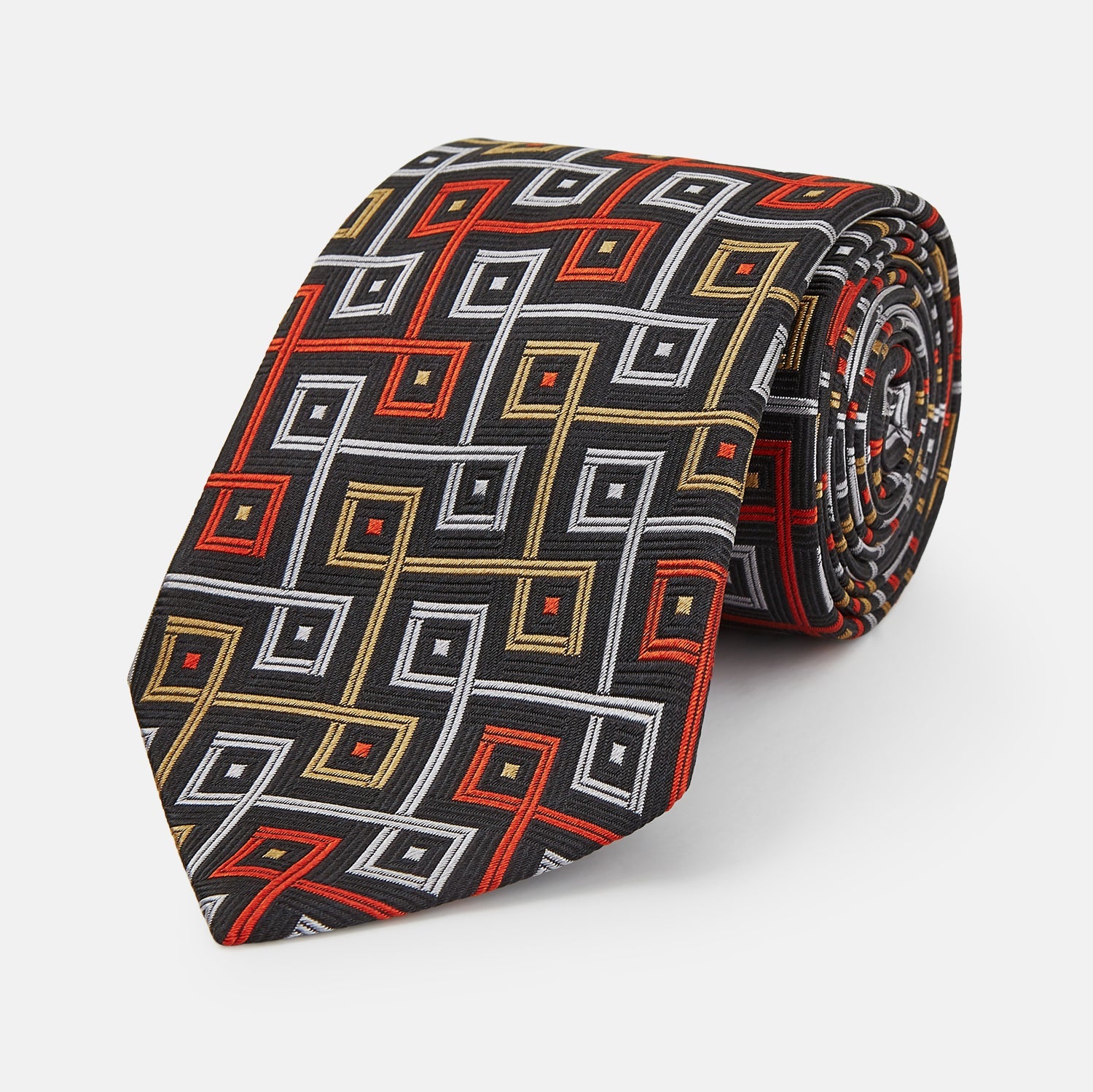 View 1 of product The Turnbull & Asser "The World Is Not Enough" Square Silk Tie, as seen on James Bond, features a geometric diamond pattern in black, red, yellow, and white on gray—an ideal stylish gift for any Bond fan.