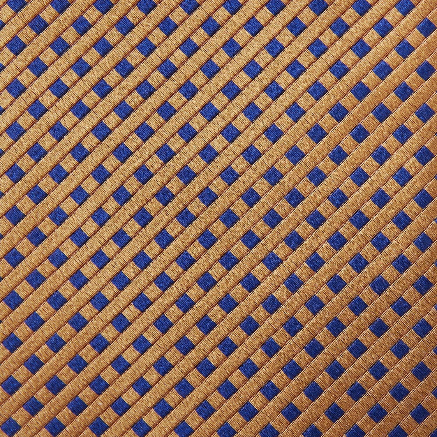 View 4 of product The Turnbull & Asser Tomorrow Never Dies Diamond Silk Tie, as seen on James Bond, features a gold and navy checkered pattern—an ideal gift for any Bond fan. Displayed rolled against a plain white background.