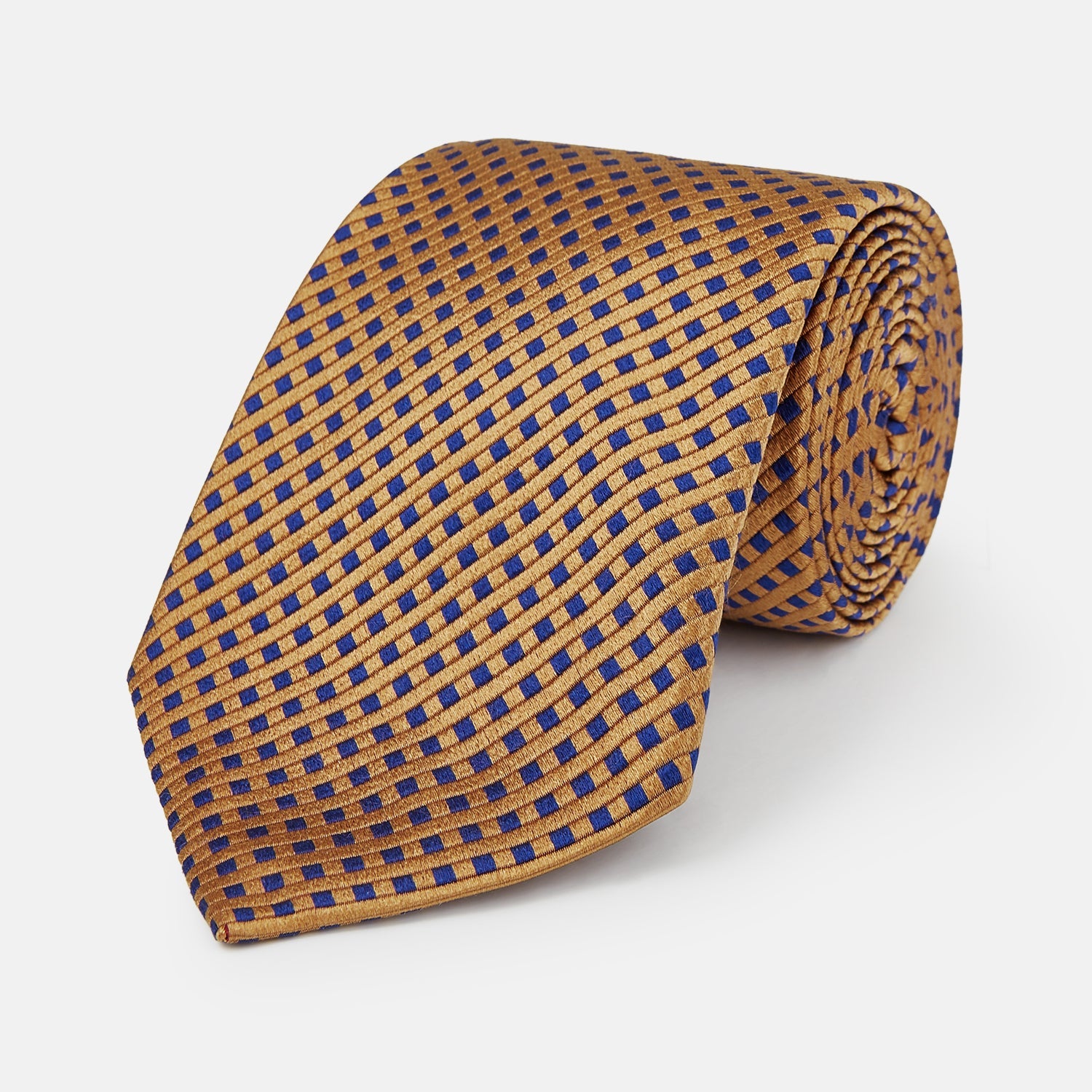 View 1 of product The Turnbull & Asser Tomorrow Never Dies Diamond Silk Tie, as seen on James Bond, features a gold and navy checkered pattern—an ideal gift for any Bond fan. Displayed rolled against a plain white background.