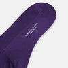 View 3 of product A single Turnbull & Asser Purple Mid-Length Merino Sock stands upright with the foot slightly raised against a plain white background.