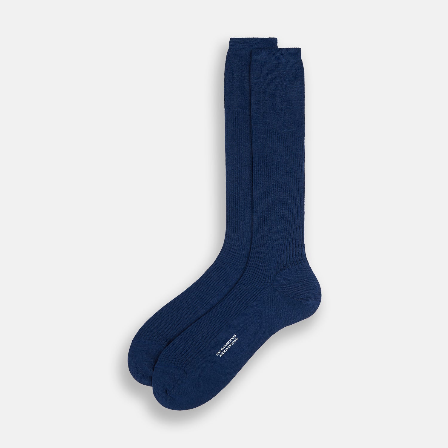 View 2 of product A single Turnbull & Asser Navy Mid-Length Merino Sock is shown upright against a white background, featuring a ribbed texture and smooth toe and heel for those seeking high-quality navy socks.