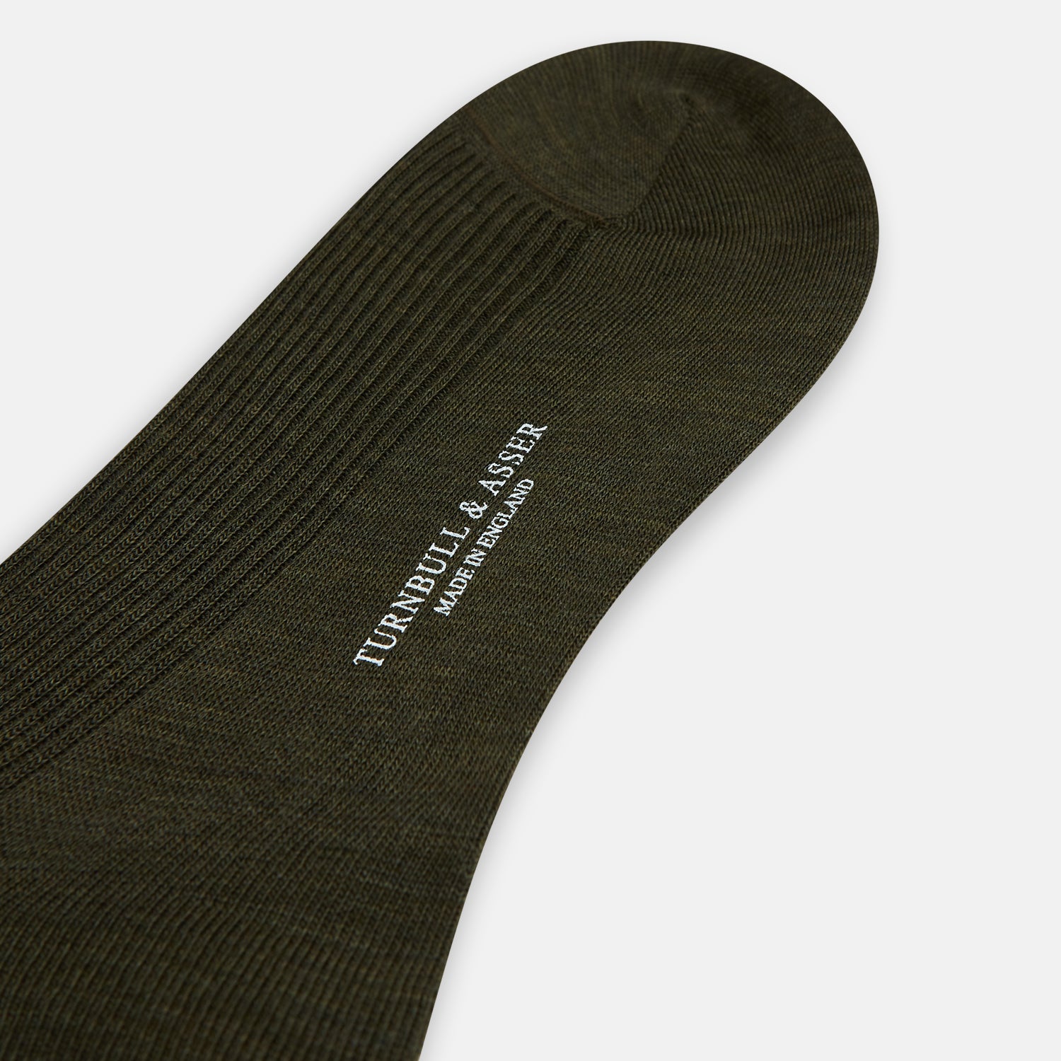 View 3 of product A Moss Green Mid-Length Merino Sock from Turnbull & Asser is shown upright on a plain white background, highlighting its ribbed texture and length with a gently curved foot.