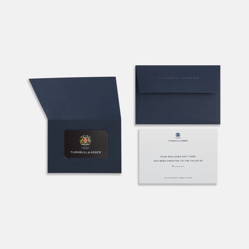 The Turnbull & Asser Gift Card (UK Only) is a black luxury card featuring a colorful royal crest, the words "By Appointment to His Majesty The King Shirtmakers," and "Turnbull & Asser" in bold white at the bottom.