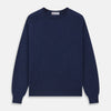 View 1 of product The Blue Crew Neck Merino Wool Jumper by Turnbull & Asser—a classic, long-sleeved staple with ribbed cuffs and hem—lies flat against a white background.