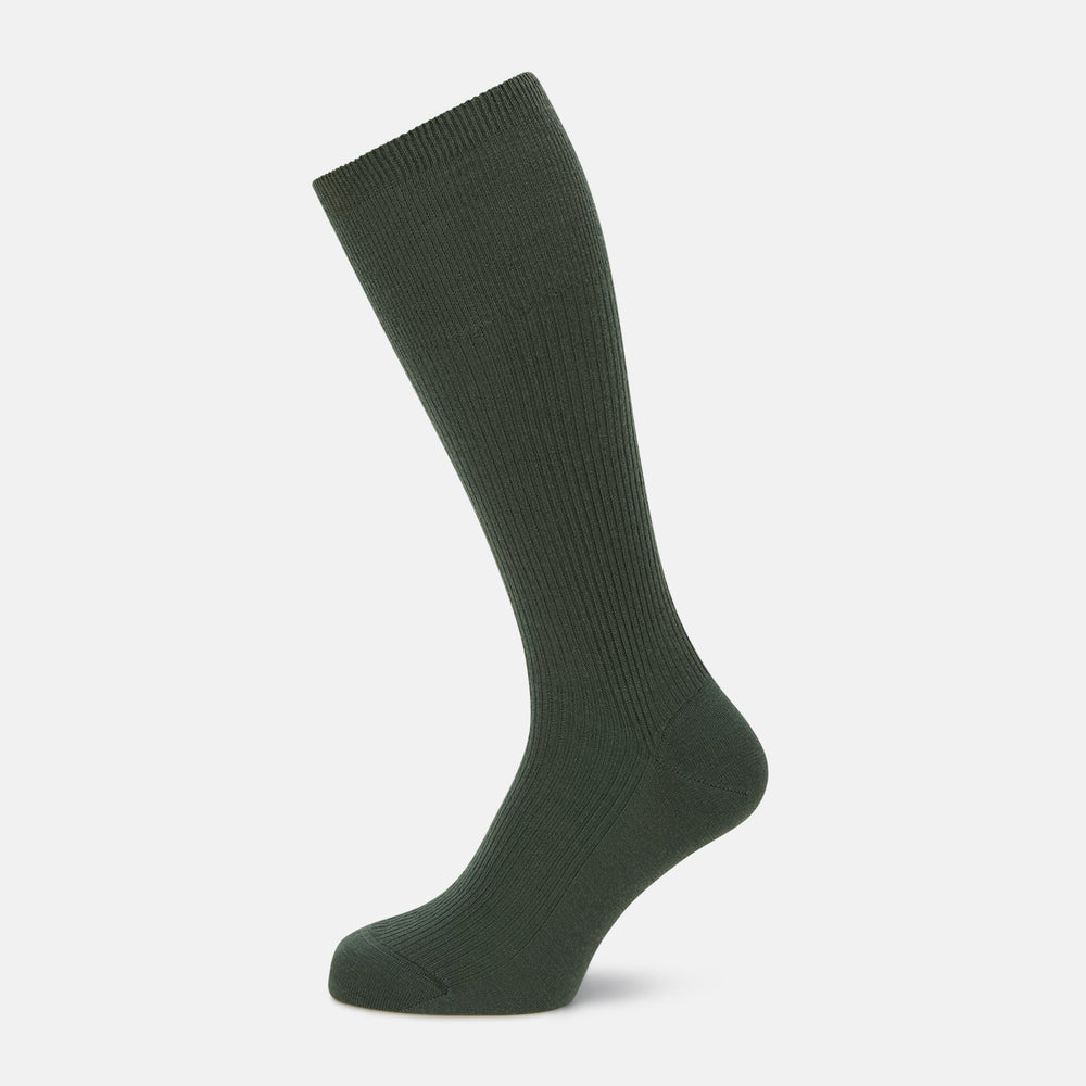 A single Fern Green Mid-Length Merino Sock by Turnbull & Asser, featuring a ribbed texture, is displayed on a plain white background at a slight angle to highlight its premium wool fabric, shape, and length.