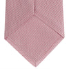 View 4 of product The Turnbull & Asser Pink Houndstooth Silk Tie, featuring a subtle textured pattern, is rolled up and displayed on a plain white background—ideal for pairing with your favorite office shirt.