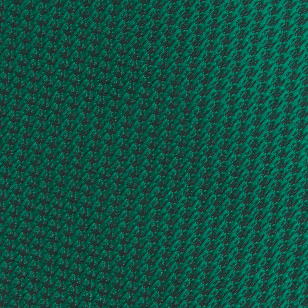 The Turnbull & Asser Green Lace Silk Tie, featuring a textured lace weave, is neatly rolled and displayed on a white background—an elegant, versatile accessory for any wardrobe.