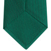 View 4 of product The Turnbull & Asser Green Lace Silk Tie, featuring a textured lace weave, is neatly rolled and displayed on a white background—an elegant, versatile accessory for any wardrobe.