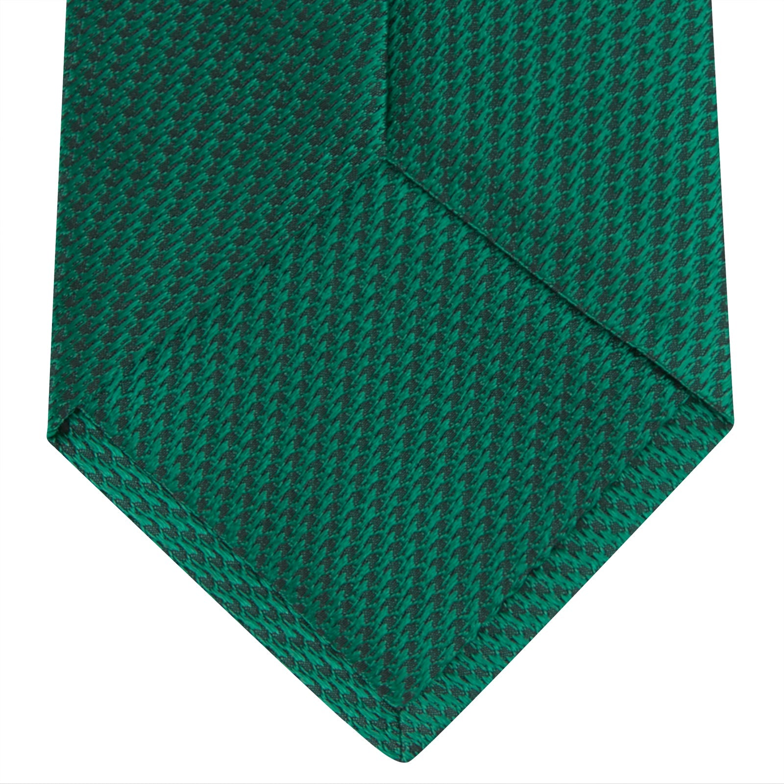 View 4 of product The Turnbull & Asser Green Lace Silk Tie, featuring a textured lace weave, is neatly rolled and displayed on a white background—an elegant, versatile accessory for any wardrobe.
