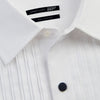 View 8 of product The Casino Royale White Dress Shirt in Cotton by Turnbull & Asser UK is a long-sleeve white dress shirt, crafted from crisp white cotton poplin with a pleated bib front, black buttons, and a classic collar, shown laid flat on a white background.