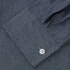 View 3 of product The Turnbull & Asser Plain Blue Oxford Weekend Fit Shirt features a Derby collar, 1-button cuffs, and a smart-casual look—perfect for weekends. Displayed flat on a white background.