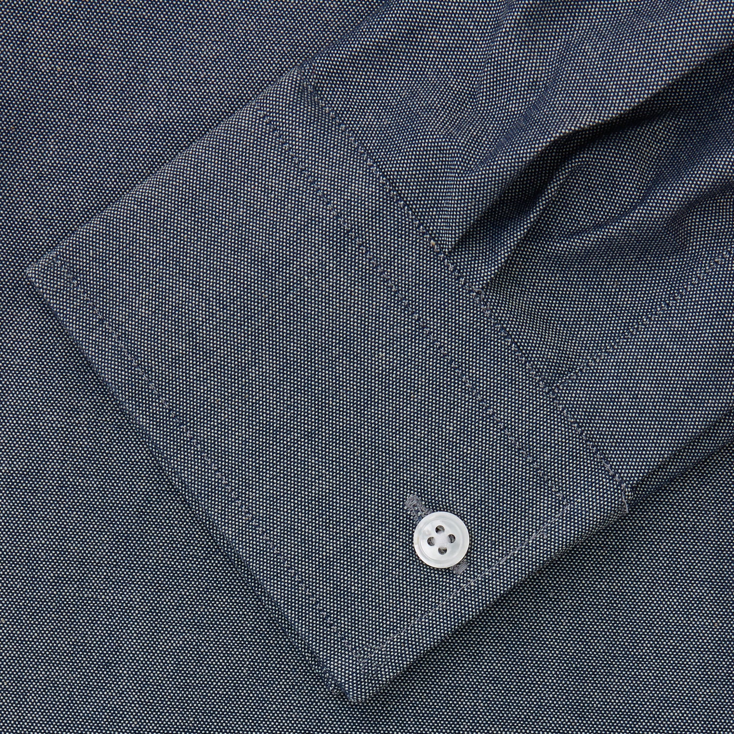 View 3 of product The Turnbull & Asser Plain Blue Oxford Weekend Fit Shirt features a Derby collar, 1-button cuffs, and a smart-casual look—perfect for weekends. Displayed flat on a white background.
