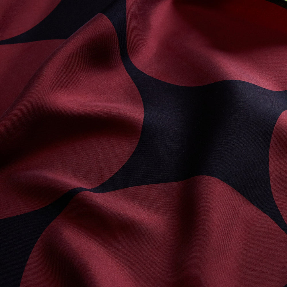 The DR. NO Red and Black Multi Spots Silk Pocket Square by Turnbull & Asser is handmade in England, featuring large red circles on black, with "Turnbull & Asser" and "Made in England" printed in white in the corners.