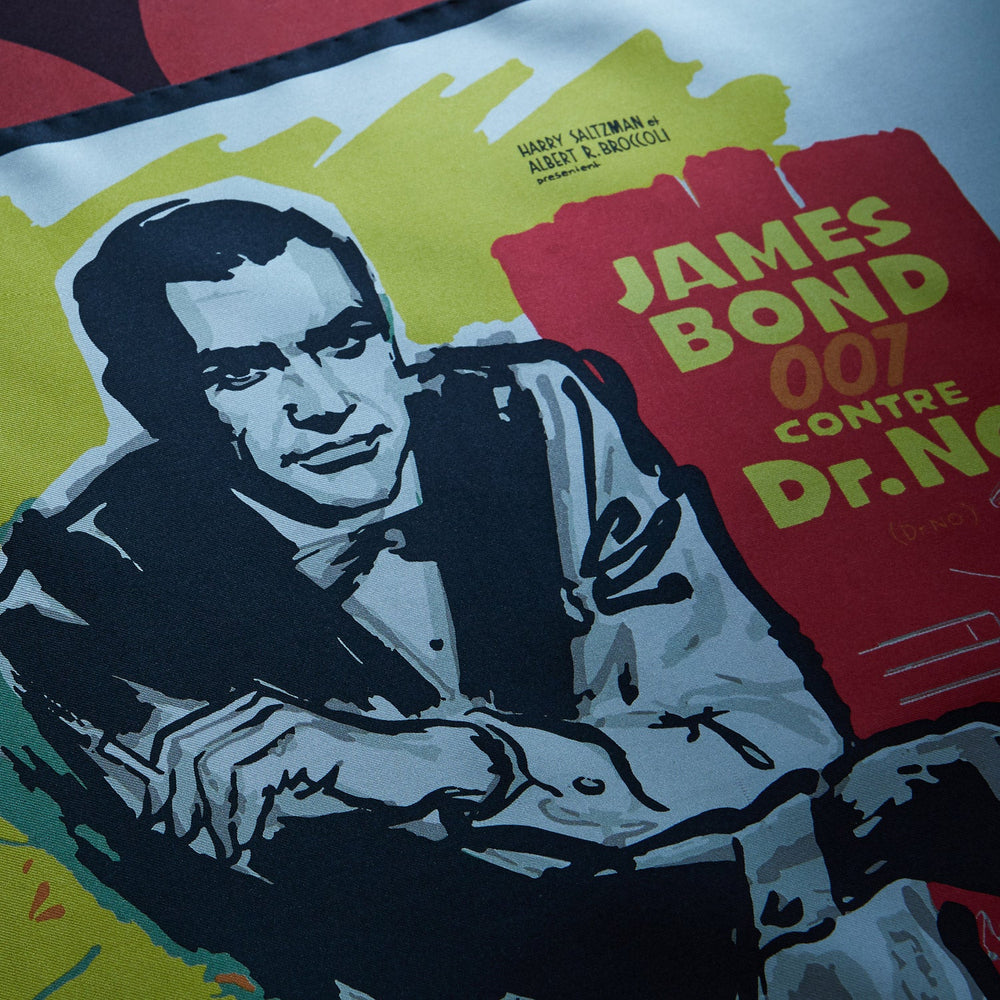 Vintage French James Bond 007 Dr. No poster featuring Sean Connery inspires the Turnbull & Asser DR. NO Yellow and Blue Poster Silk Pocket Square—handmade in England with bold illustrated colors.
