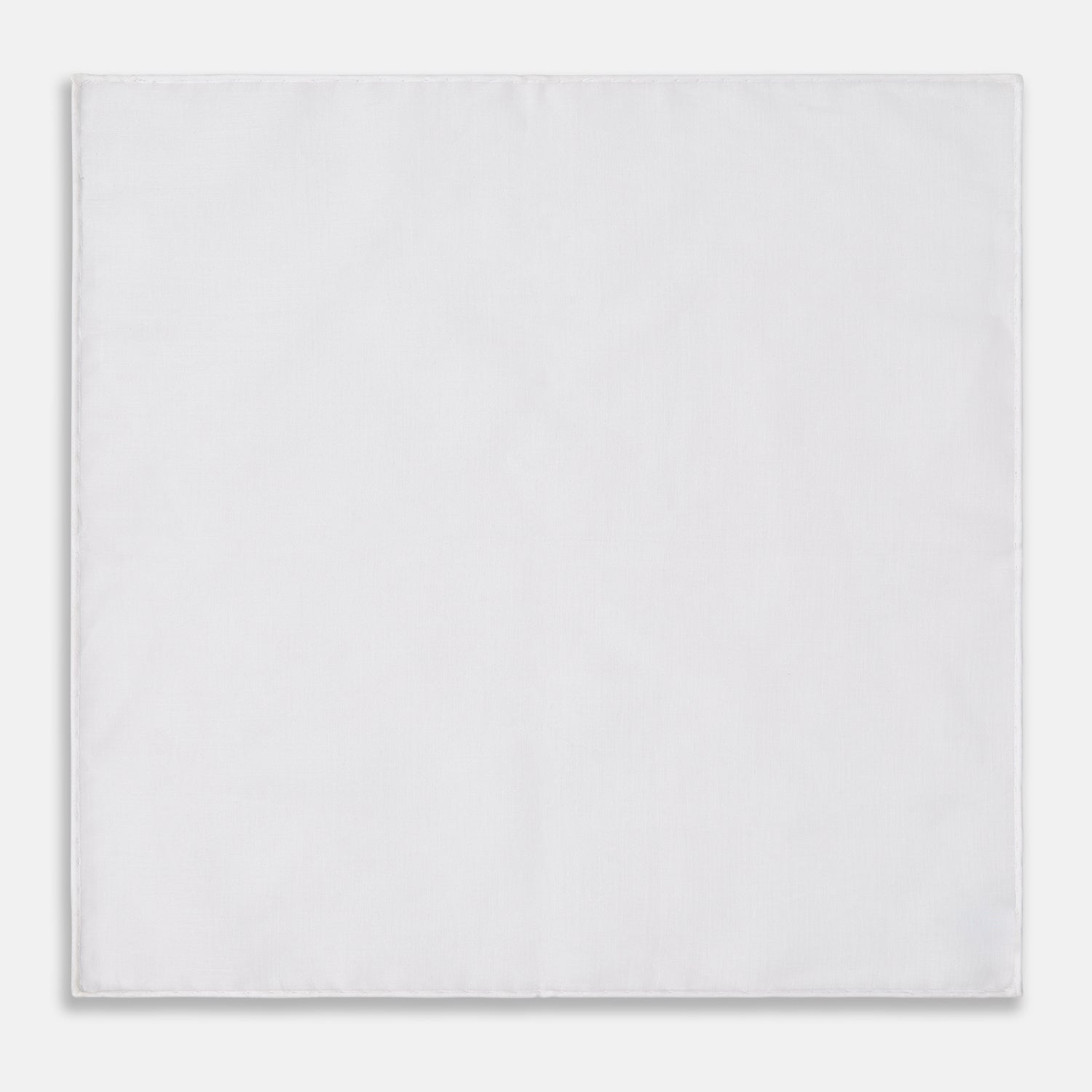 View 1 of product The James Bond Voile Pocket Square by Turnbull & Asser, in plain white with hand-rolled edges, is neatly folded and laid flat on a white background—a classic accessory for timeless style.