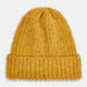 The Turnbull & Asser Yellow Donegal Ribbed Merino Hat features a mustard hue, folded brim, and subtle multicolored flecks in the yarn. Shown on a white background.