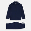View 1 of product The Turnbull & Asser Navy Cashmere Knitted Traditional Pyjama Set features a long-sleeve camp collar shirt with front pockets and matching drawstring pants, offering an elevated twist on classic loungewear.