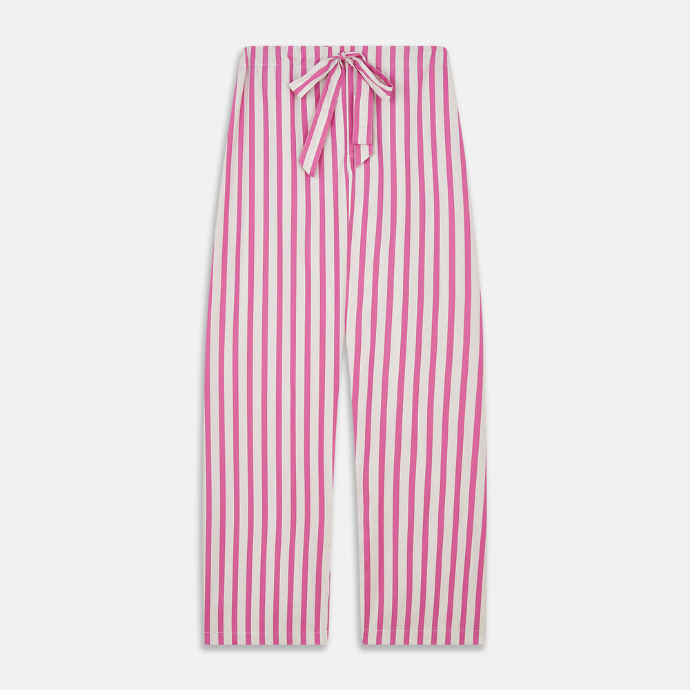 The Turnbull & Asser Pink Candy Stripe Cotton Traditional Pyjamas feature long sleeves, pants, vertical pink candy stripes, a camp collar shirt with buttons, chest pocket, and navy trim on the pocket and cuffs.