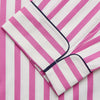 View 5 of product The Turnbull & Asser Pink Candy Stripe Cotton Traditional Pyjamas feature long sleeves, pants, vertical pink candy stripes, a camp collar shirt with buttons, chest pocket, and navy trim on the pocket and cuffs.