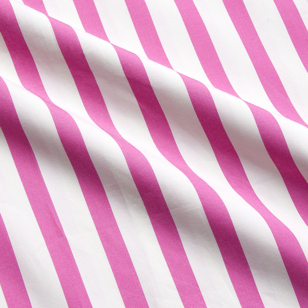 The Turnbull & Asser Pink Candy Stripe Cotton Traditional Pyjamas feature long sleeves, pants, vertical pink candy stripes, a camp collar shirt with buttons, chest pocket, and navy trim on the pocket and cuffs.